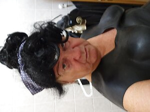 perv rubber bessy ,ramming the black stick deeply ,wank on rubber boot ,swallows