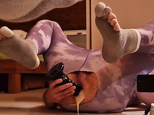 Boy in toe socks shoves a fat black dildo deep into his anus to cum properly with cum lube