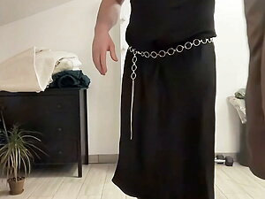 Black satin fetish long dress and silk jacket and high heels overknee boots and my cock hard and horny. Suck me gently